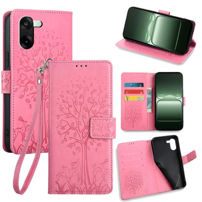 Embossed leather phone case in pink with tree-deer pattern, flip cover, wrist strap