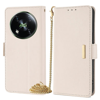 Crossbody leather phone case in light beige with gold chain strap and magnetic side flap.