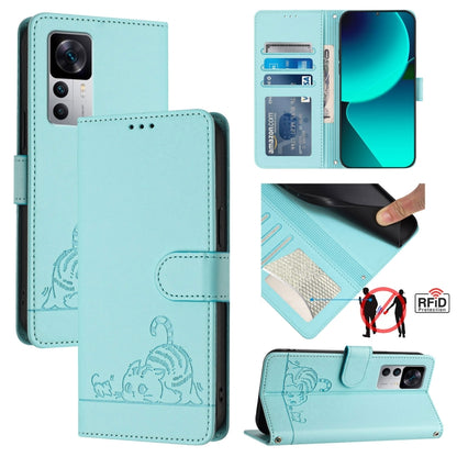 Mint green RFID leather phone case with lanyard; embossed cat/rat pattern and card slot flap.