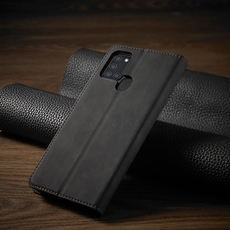 Black flip phone wallet case back with camera cutout and stitched edge