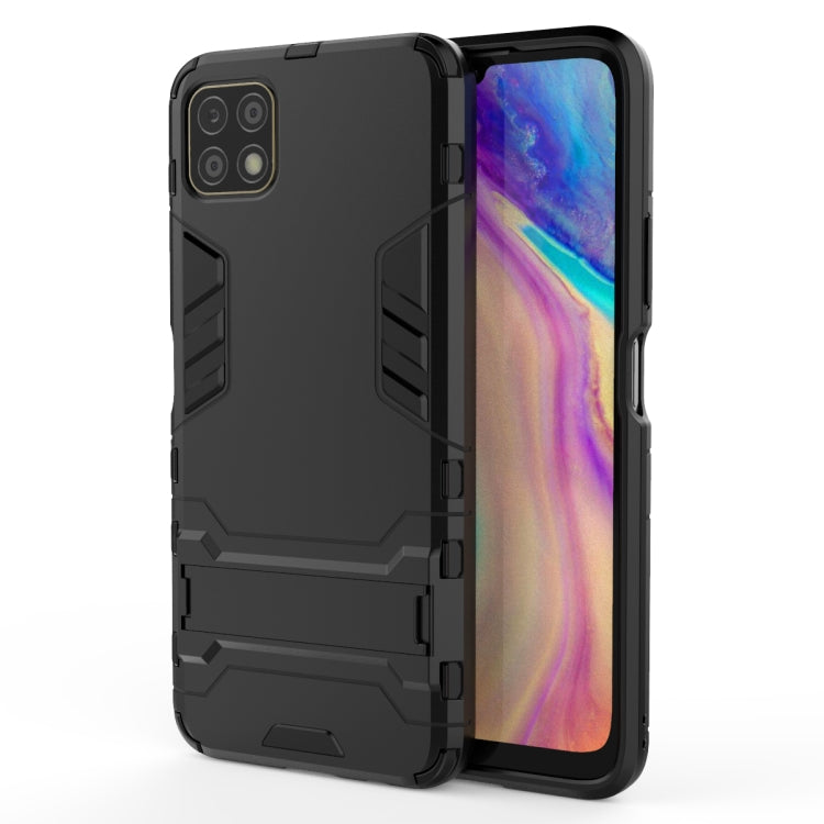 Black rugged shockproof phone case with holder, textured side grips and camera cutouts