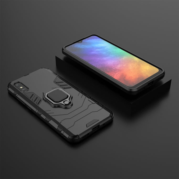 Black protective phone case with magnetic ring holder and rugged textured back