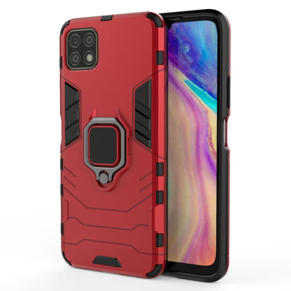 Red anti-fall phone case with magnetic ring holder, rugged PC TPU protection.