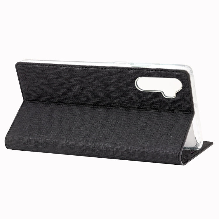 Black magnetic flip phone case with horizontal stand and camera opening