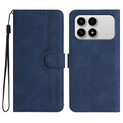 Blue heart-pattern faux leather flip phone case with wrist strap and camera cutout.
