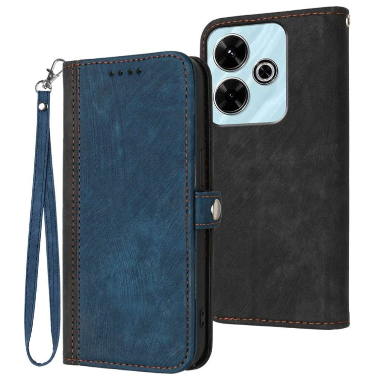Blue leather double-fold phone case with wrist strap and stitched edges; black back cover visible