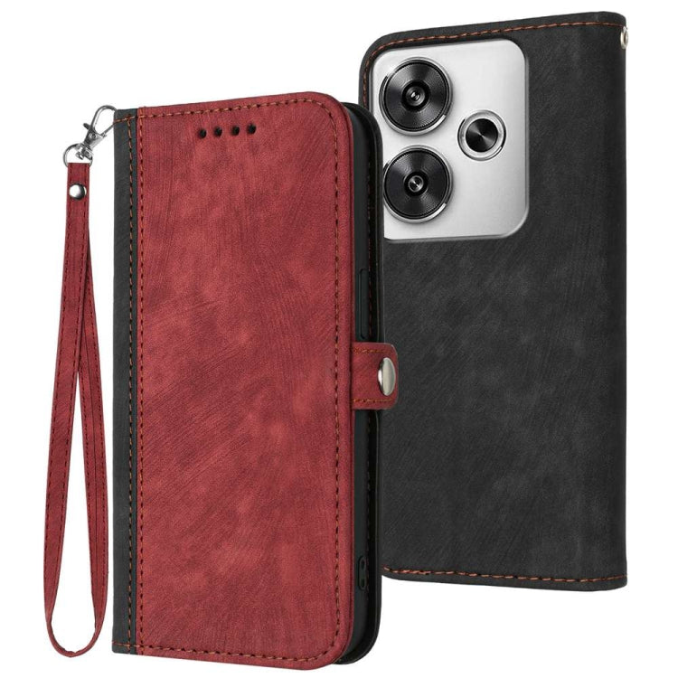 Burgundy leather double-fold phone case with wrist strap and stitched edges; black back cover visible