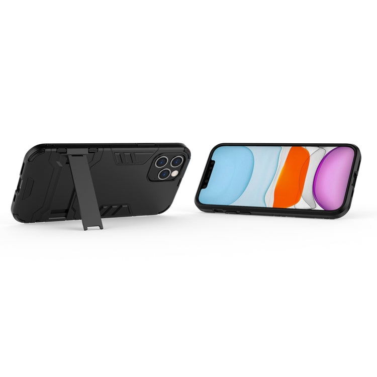 Shockproof protective phone case in black with kickstand-style holder and cutouts
