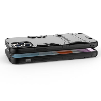 Shockproof phone case in black with textured sides and raised lip around the screen