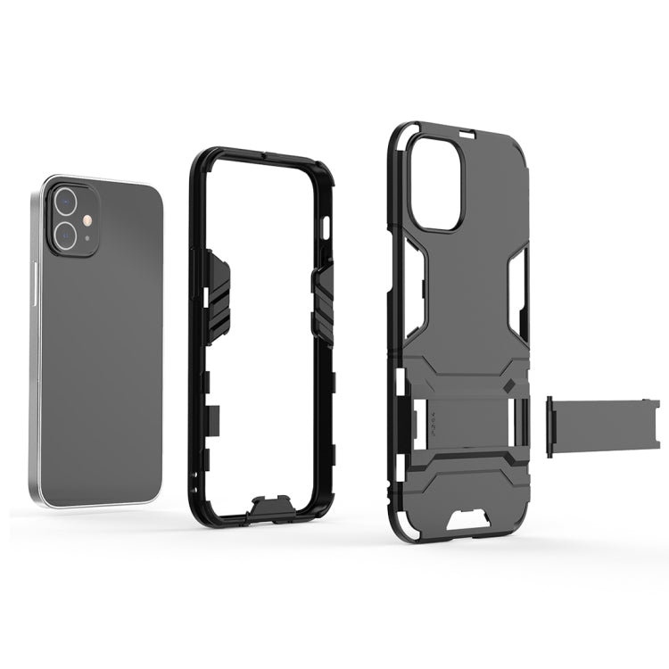Shockproof phone case in black with built-in holder tab, port openings, and camera cutout