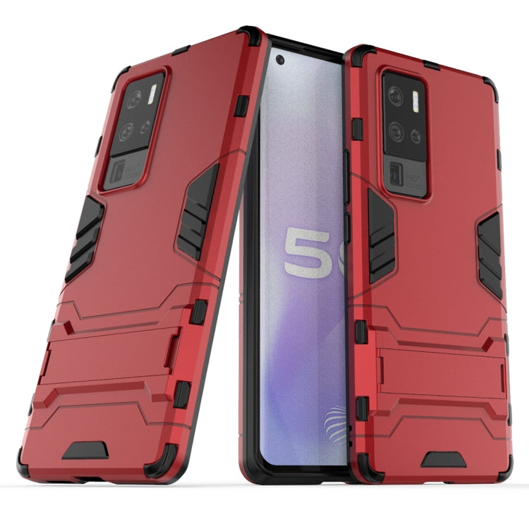 Shockproof protective phone case with built-in holder, red, rugged bumper design.