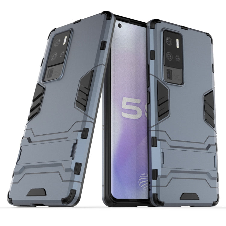 Shockproof protective phone case with built-in holder, light gray, rugged bumper design.