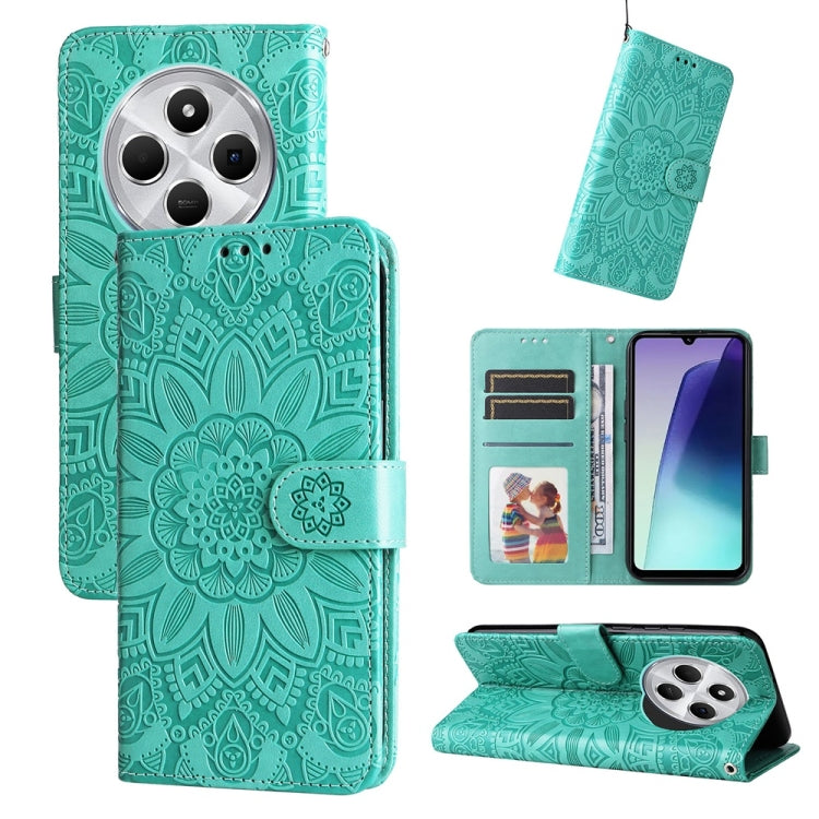 Teal green wallet-style phone case with embossed sunflower pattern, card slots, and stand