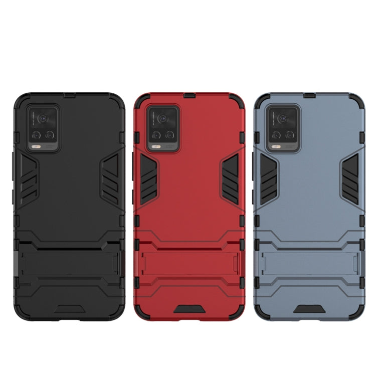 Rugged shockproof phone cases in black, red, and blue with camera cutouts