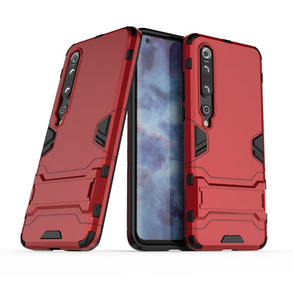 Red rugged protective phone case with raised corners and cutouts for camera and ports