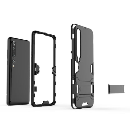 Rugged protective phone case in black and gray with open sides and visible cutouts