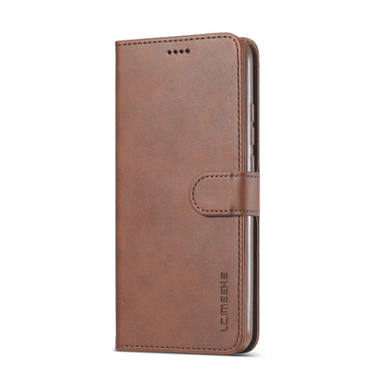 Brown leather flip phone case with strap closure and front card slot panel