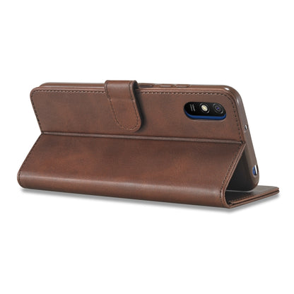 Brown leather folio flip phone case with strap and camera opening