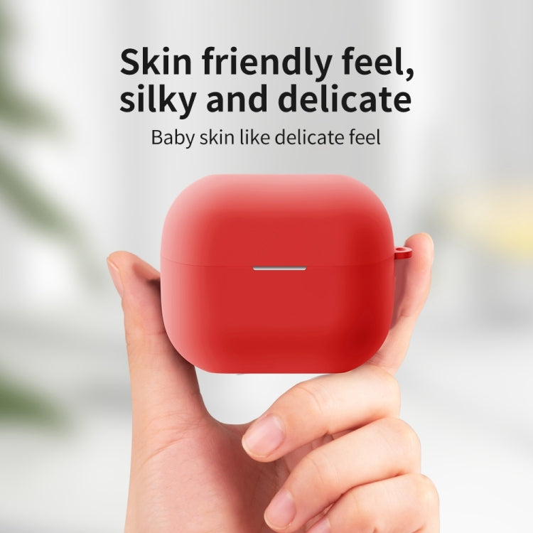 Red silicone protective earbud case held in hands, with slim bar cutout and side loop