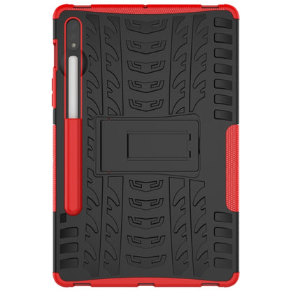 Red rugged tablet case with textured back, cutouts, and built-in holder panel