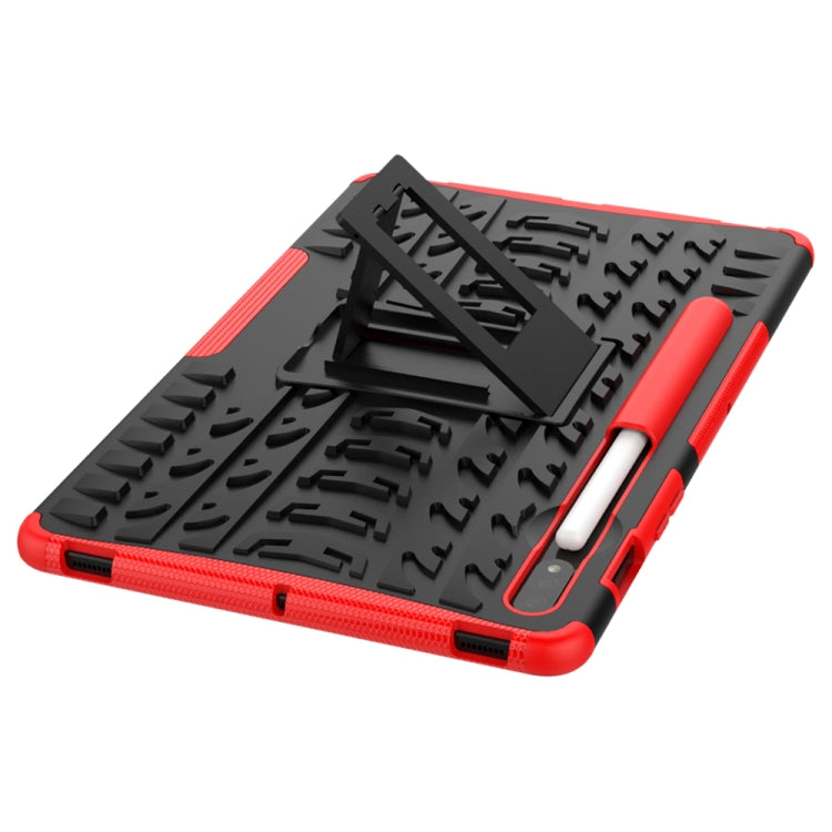 Red rugged tablet case with textured surface and fold-out kickstand, angled view