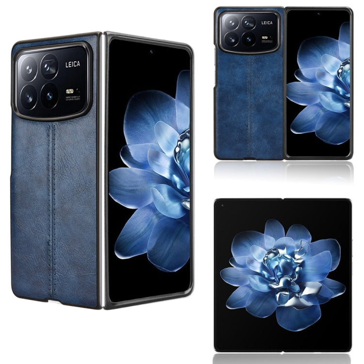 Flip-style sewing back phone case with blue faux-leather flap and black trim