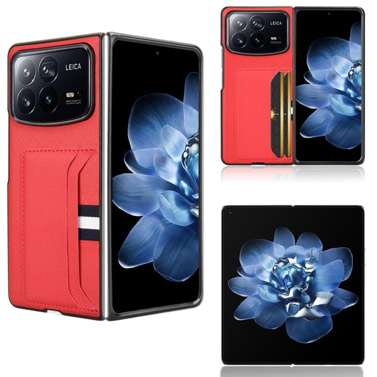 Red phone case with litchi texture and card slot; flip cover with striped band.