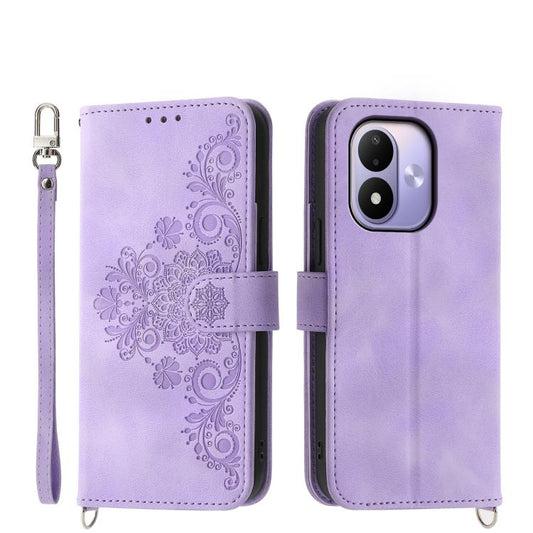 Purple embossed floral leather wallet phone case with wrist strap and magnetic closure