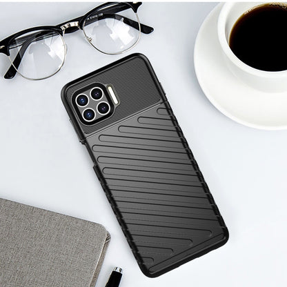 Black shockproof TPU phone case with ridged grip pattern and camera cutouts