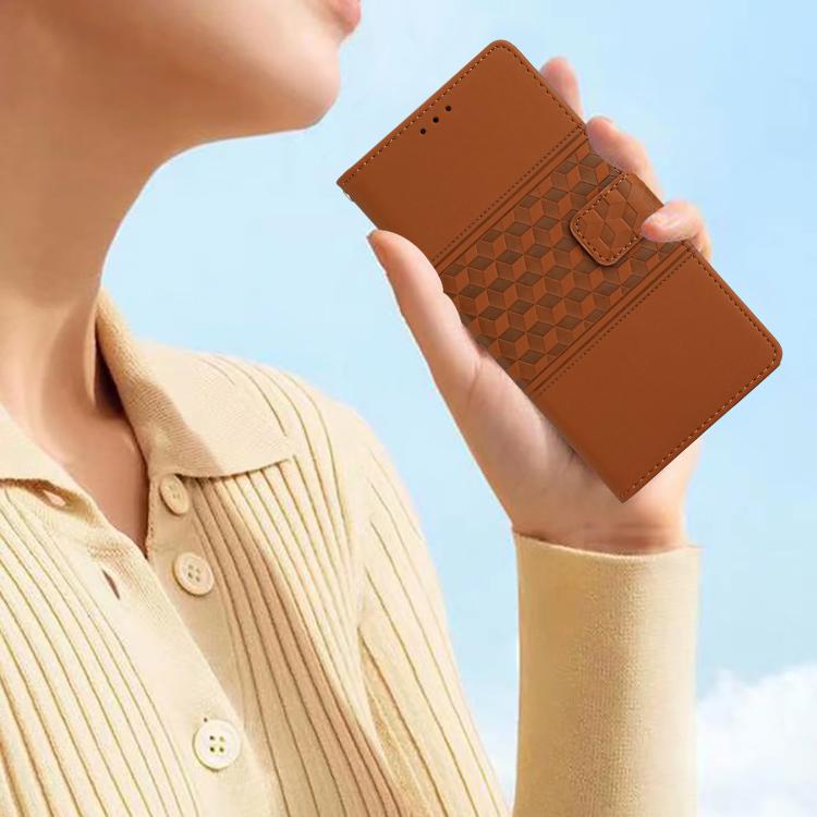 Brown leather phone wallet case with diamond embossed panel held in hand