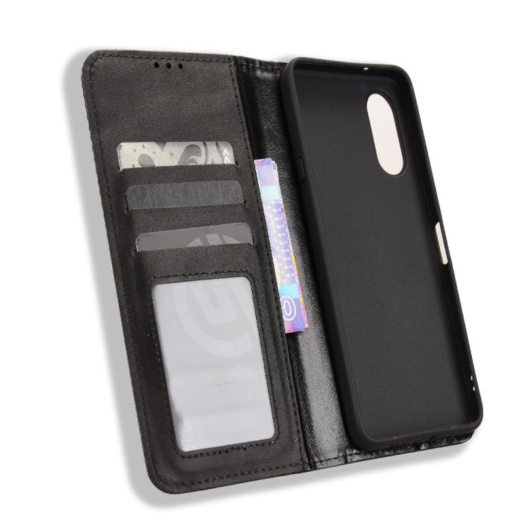 Black folio leather phone case with card window and interior storage pocket