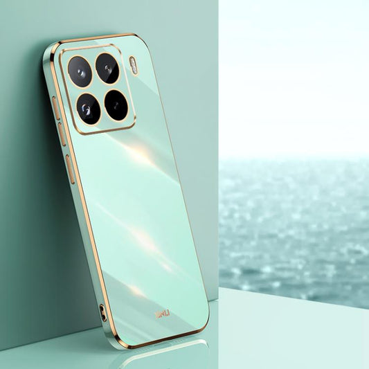 Mint green TPU phone case with gold electroplated edges and quad camera cutouts
