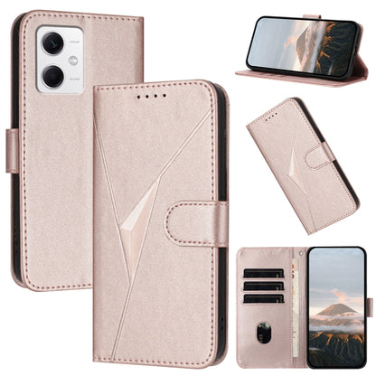 Light pink leather folio phone case with triangle pattern, buckle clasp, stand view