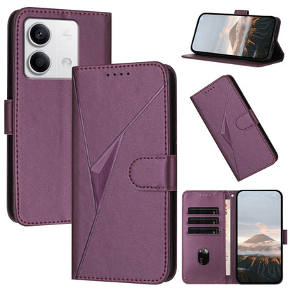 Dark purple leather phone case with triangle pattern, buckle clasp, and card slots
