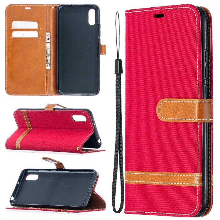 Red denim-texture flip phone wallet case with tan accents, card slots, and lanyard strap
