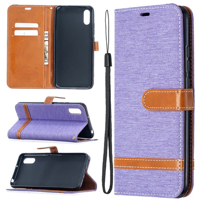 Purple denim-texture flip phone wallet case with card slots and lanyard strap