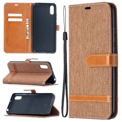 Light brown denim-texture flip phone wallet case with tan card-slot panel and lanyard strap