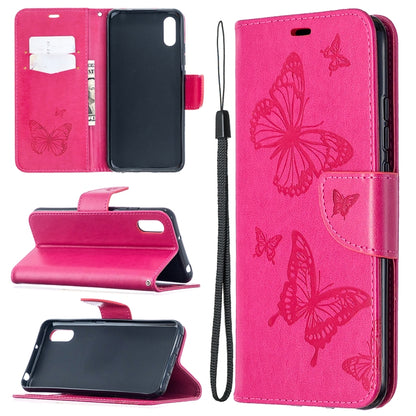 Pink leather-look phone wallet case with butterfly print, card slots, stand, and lanyard