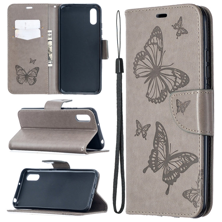 Grey leather-look phone wallet case with butterfly print, card slots, stand, and lanyard
