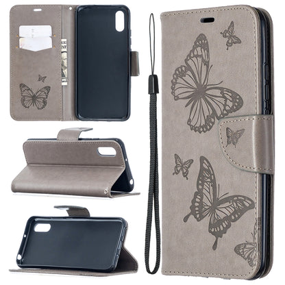 Grey leather-look phone wallet case with butterfly print, card slots, stand, and lanyard