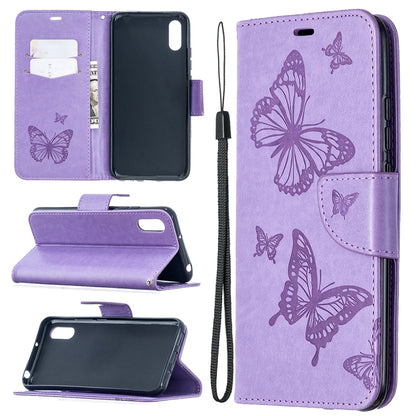 Lavender purple leather-look phone wallet case with butterfly print, card slots, stand, and lanyard