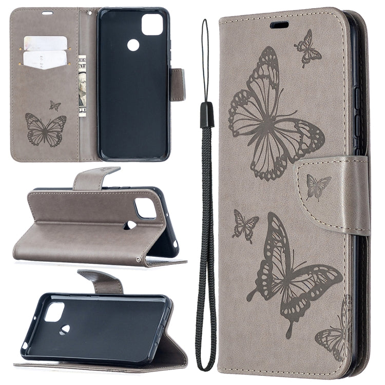 Dark grey leather-look phone wallet case with butterfly print, card slots, stand, and lanyard