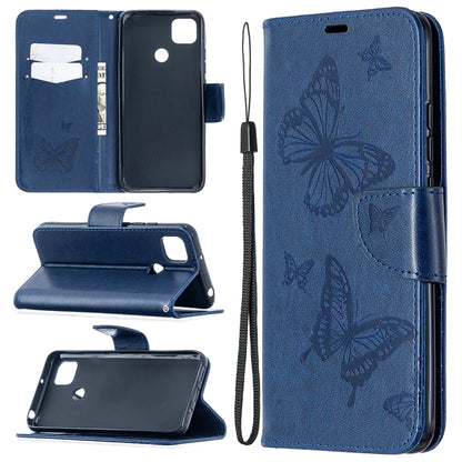 Navy blue leather-look phone wallet case with butterfly print, card slots, stand, and lanyard