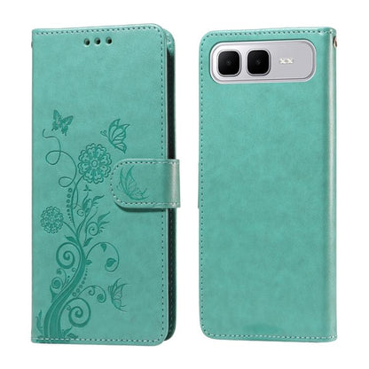 Teal leather wallet phone case with embossed butterfly and floral pattern, side strap