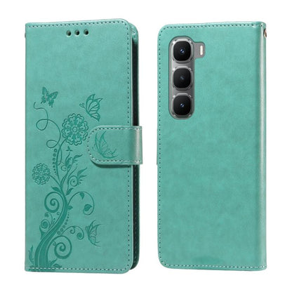 Teal leather wallet phone case with embossed butterfly and floral pattern, side strap