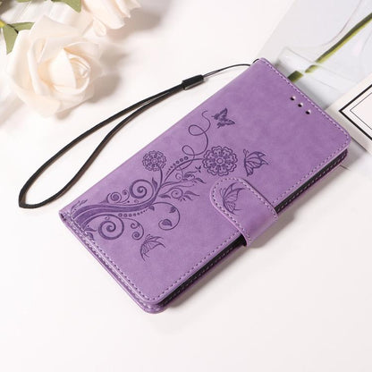 Purple leather flip phone case with embossed butterfly and floral pattern, wallet with side strap.