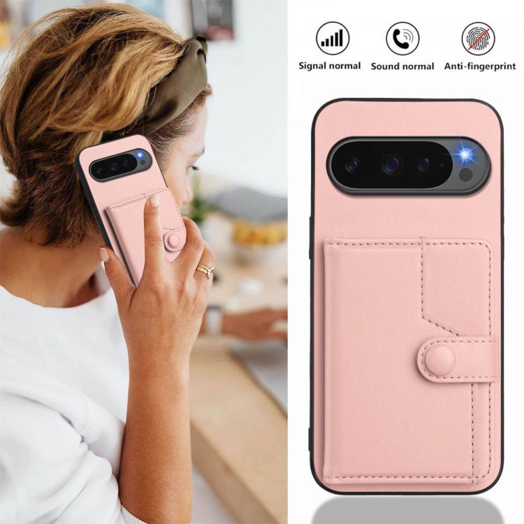 Pink phone case with card wallet and snap button strap; close-up on front cover.