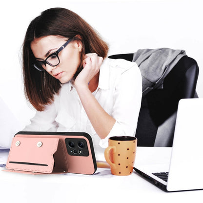 Pink phone case with wallet flap and stand, worn setup with wrist strap, camera openings visible