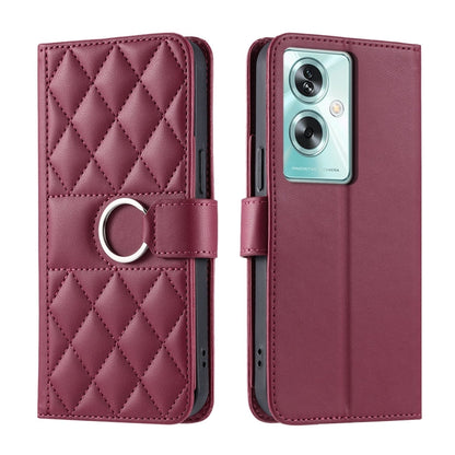 Maroon leather phone case with rhombus quilt, ring-buckle strap, and flip cover