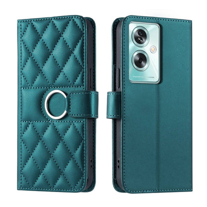 Teal leather phone case with rhombus quilt, ring-buckle strap, and flip cover